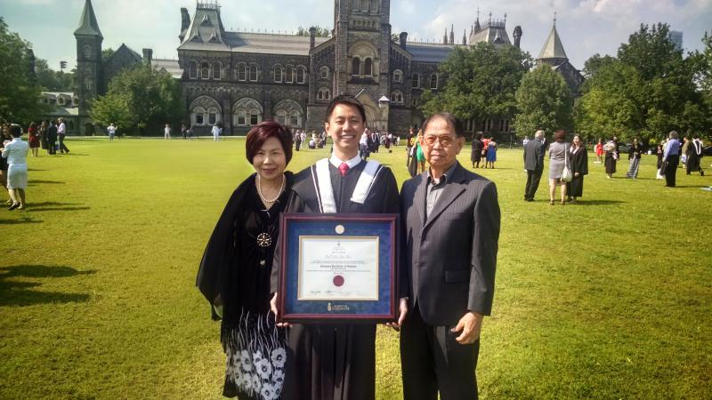 Joel Tan with his parents after his June 2014 convocation at University College.