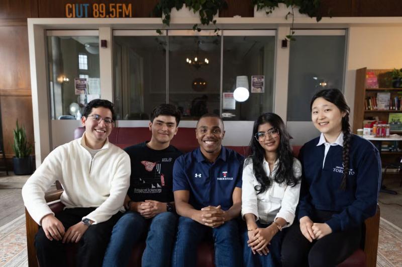 Five members of U of T's Class of 2026 gather for a portrait.