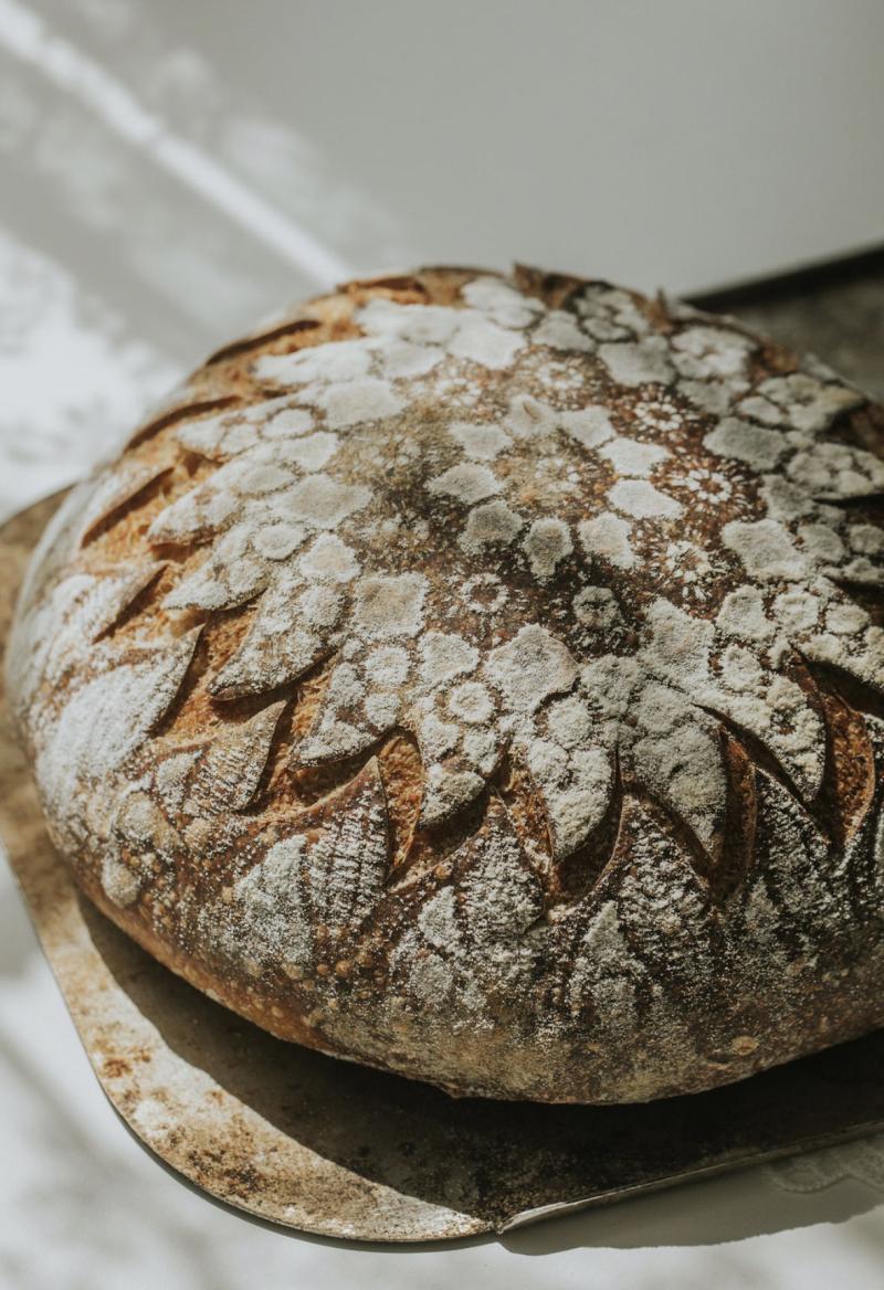Decorated sourdough bread accompanies Pardoe's account of her baking practice.
